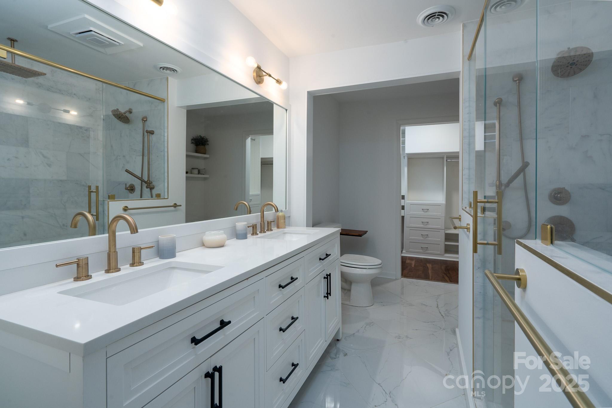 2066 Marquesas Avenue Fort Mill, SC 29708 - Photo 29 of 45 a bathroom with a double vanity sink toilet mirror and bathtub