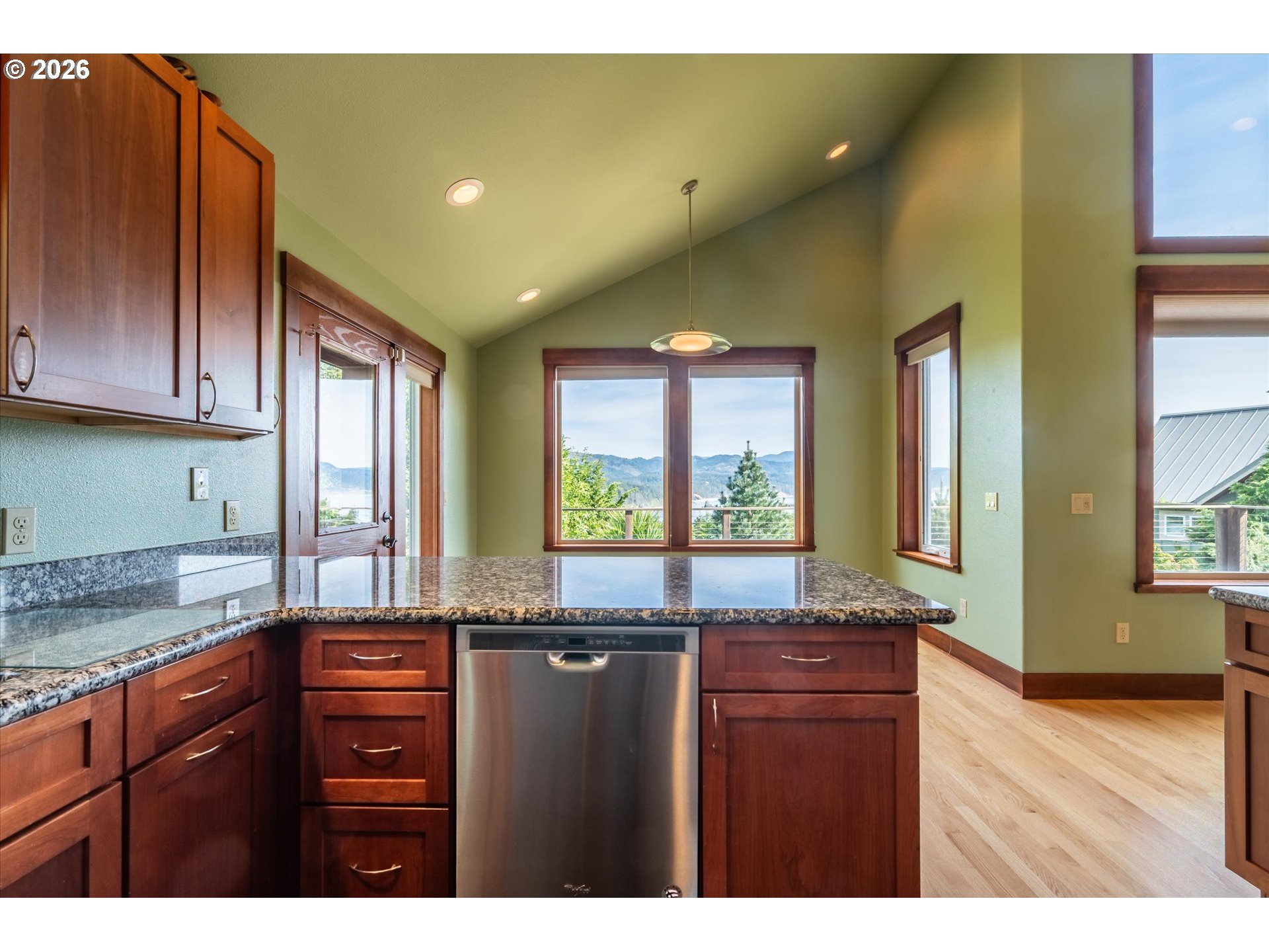 650 Tichenor Cemetery Road Port Orford, OR 97465 - Photo 12 of 48 a kitchen with a sink a window and cabinets