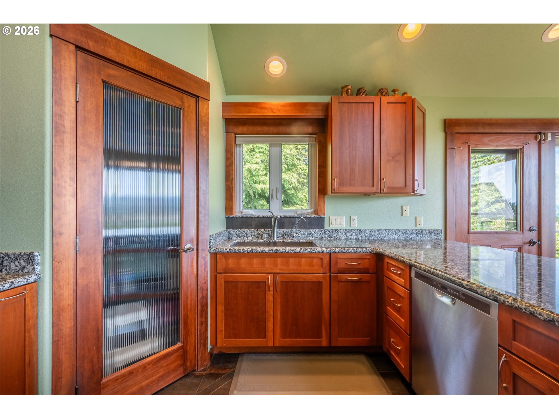 650 Tichenor Cemetery Road Port Orford, OR 97465 - Photo 13 of 48 a kitchen with stainless steel appliances granite countertop a sink and a window