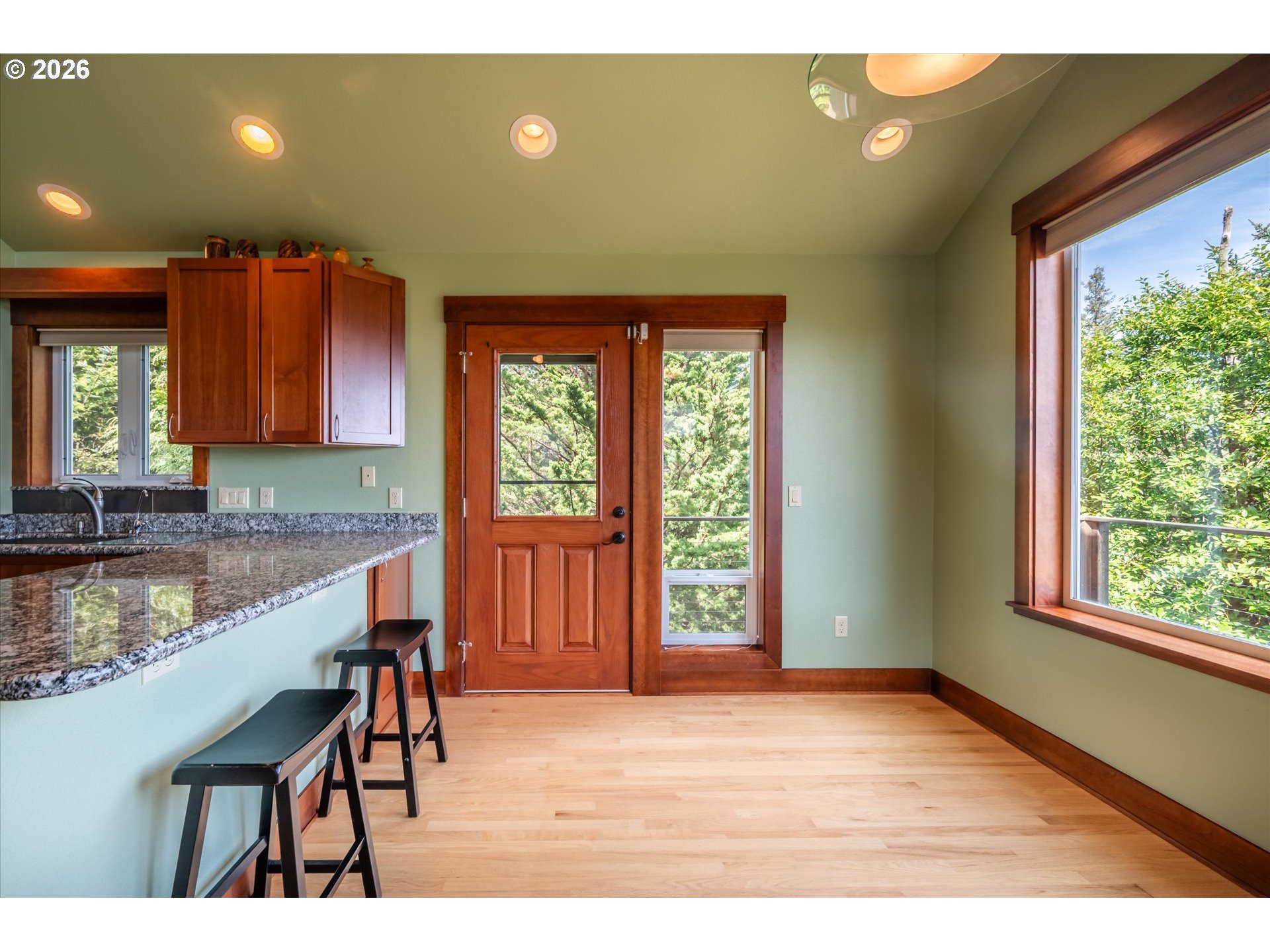 650 Tichenor Cemetery Road Port Orford, OR 97465 - Photo 15 of 48 a kitchen with granite countertop a stove a sink and a microwave