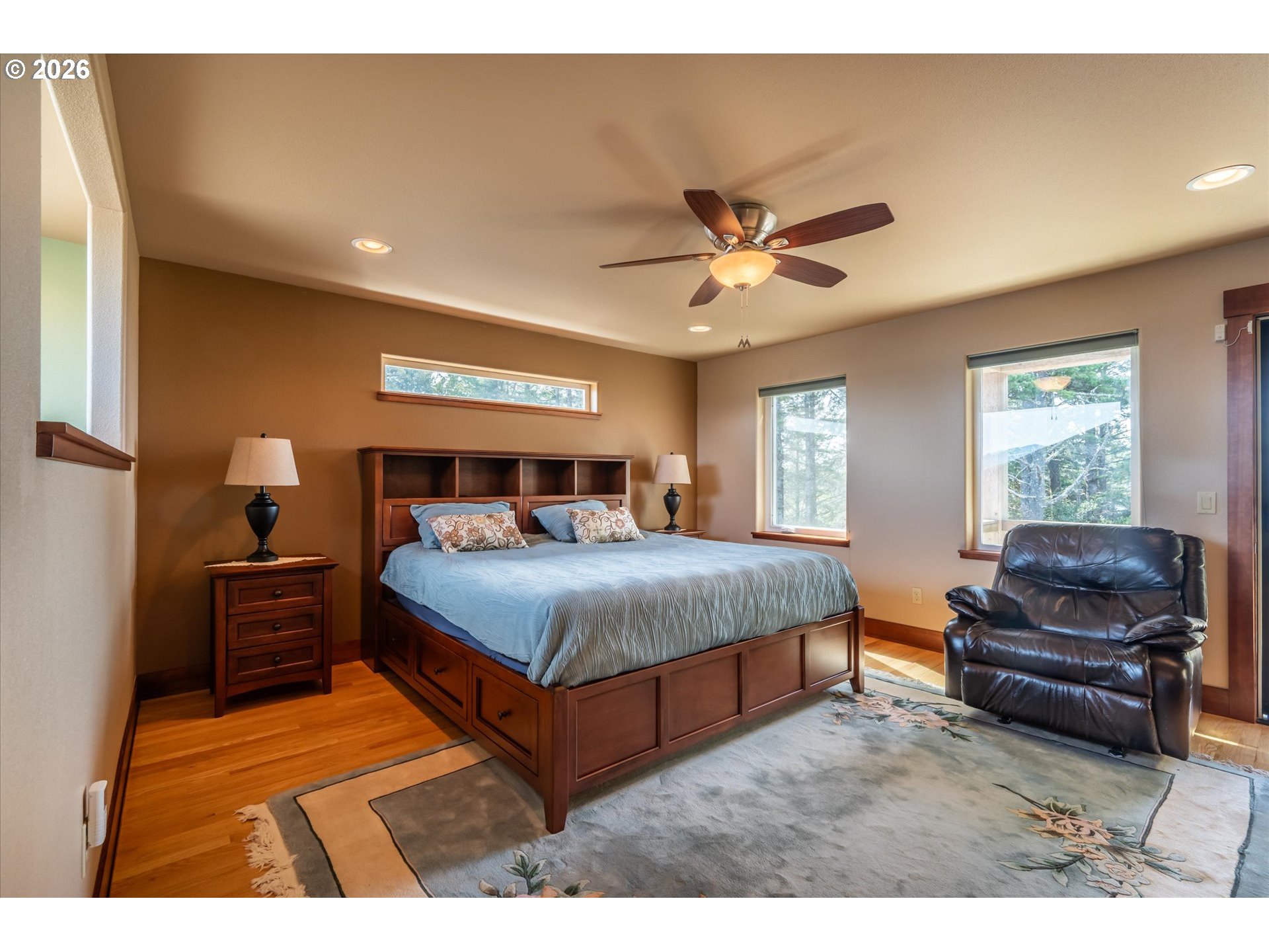 650 Tichenor Cemetery Road Port Orford, OR 97465 - Photo 18 of 48 a bedroom with a bed window and couch
