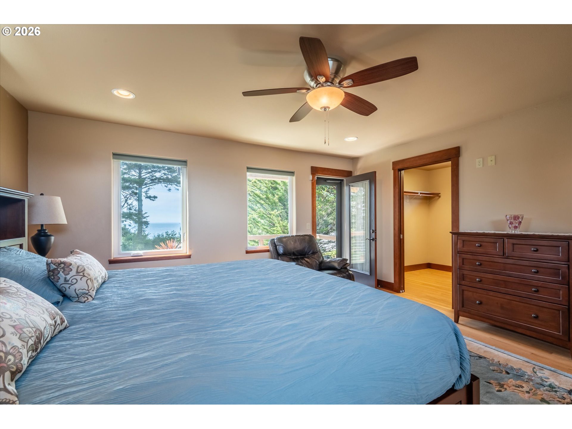 650 Tichenor Cemetery Road Port Orford, OR 97465 - Photo 19 of 48 a bedroom with a bed and window with couch