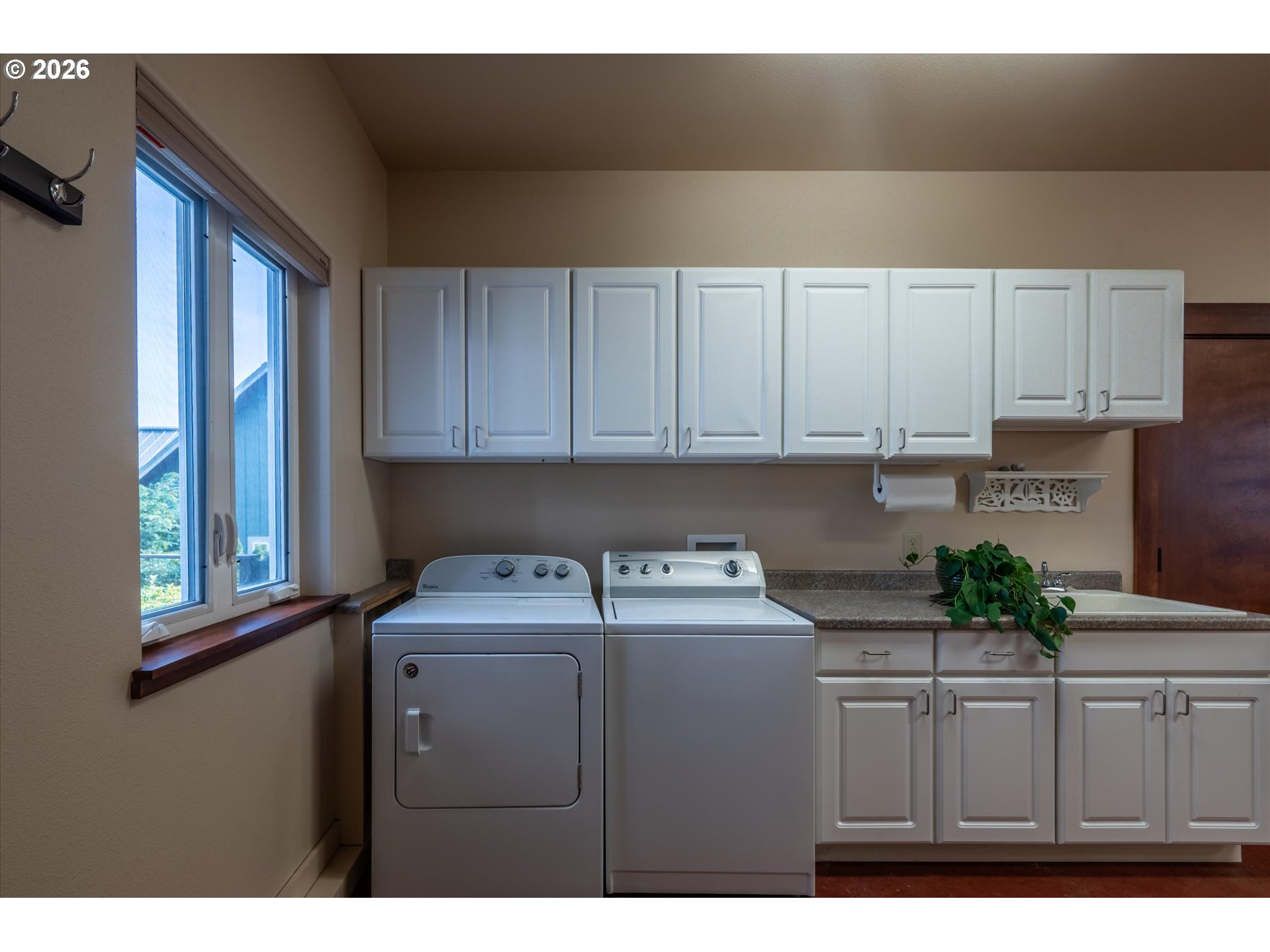 650 Tichenor Cemetery Road Port Orford, OR 97465 - Photo 30 of 48 a utility room with cabinets washer and dryer