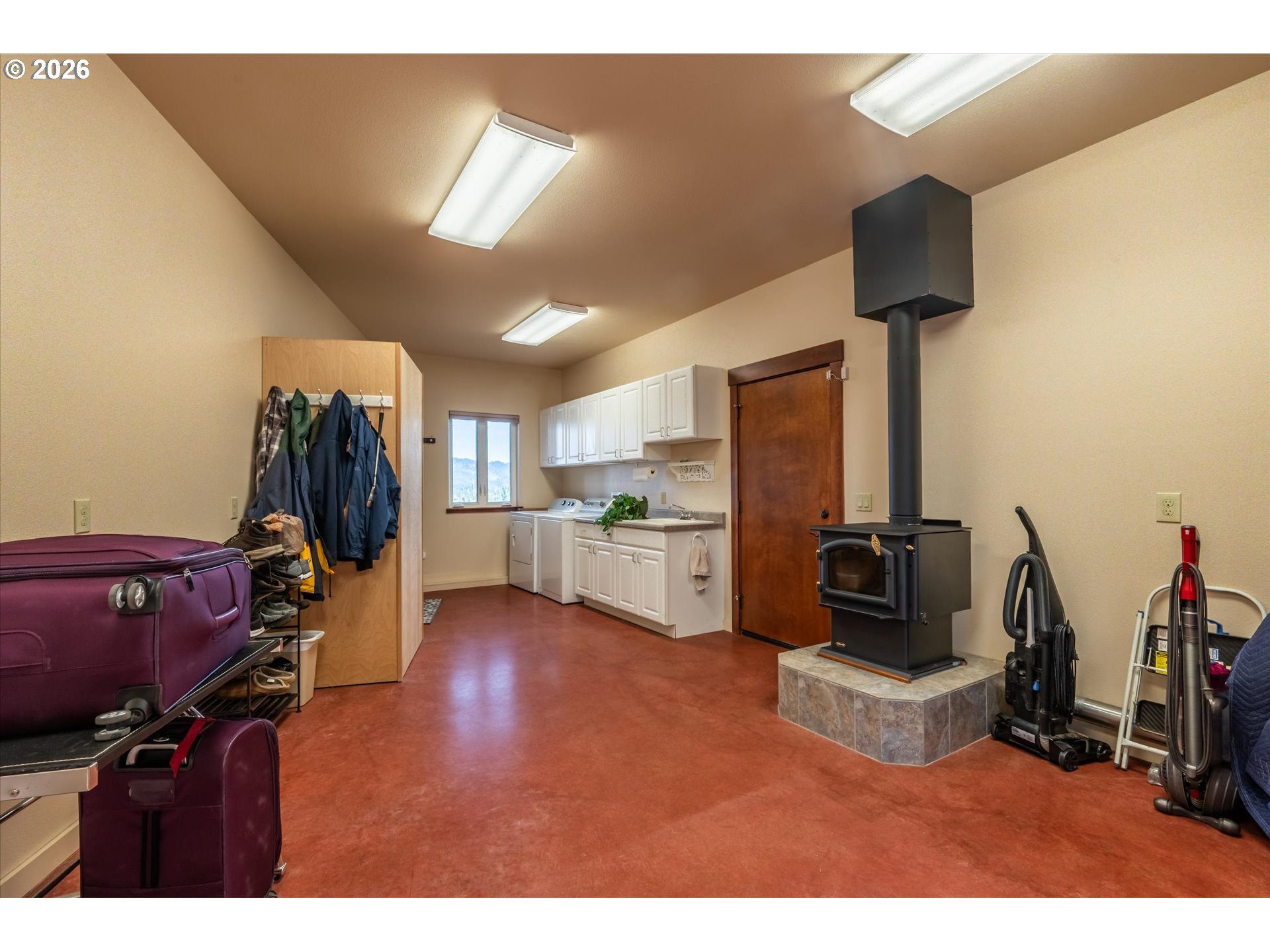 650 Tichenor Cemetery Road Port Orford, OR 97465 - Photo 31 of 48 a living room with furniture and a flat screen tv