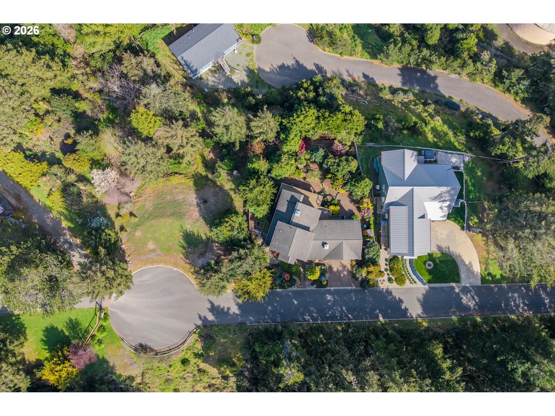 650 Tichenor Cemetery Road Port Orford, OR 97465 - Photo 39 of 48 a view of a house with a yard and garden