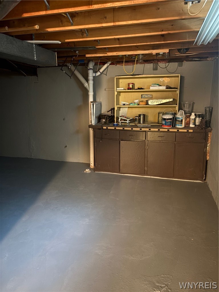 8421 Forest Road Royalton, NY 14067 - Photo 28 of 35 Basement Workbench and Storage Area