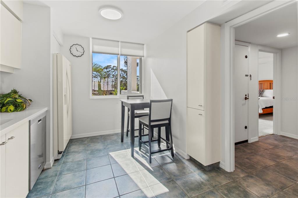 829 Bayport Way, Unit 829 Longboat Key, FL 34228 - Photo 12 of 58 a view of kitchen with furniture and wooden floor