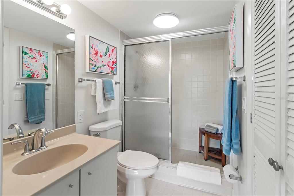 829 Bayport Way, Unit 829 Longboat Key, FL 34228 - Photo 29 of 58 a bathroom with a sink toilet and shower