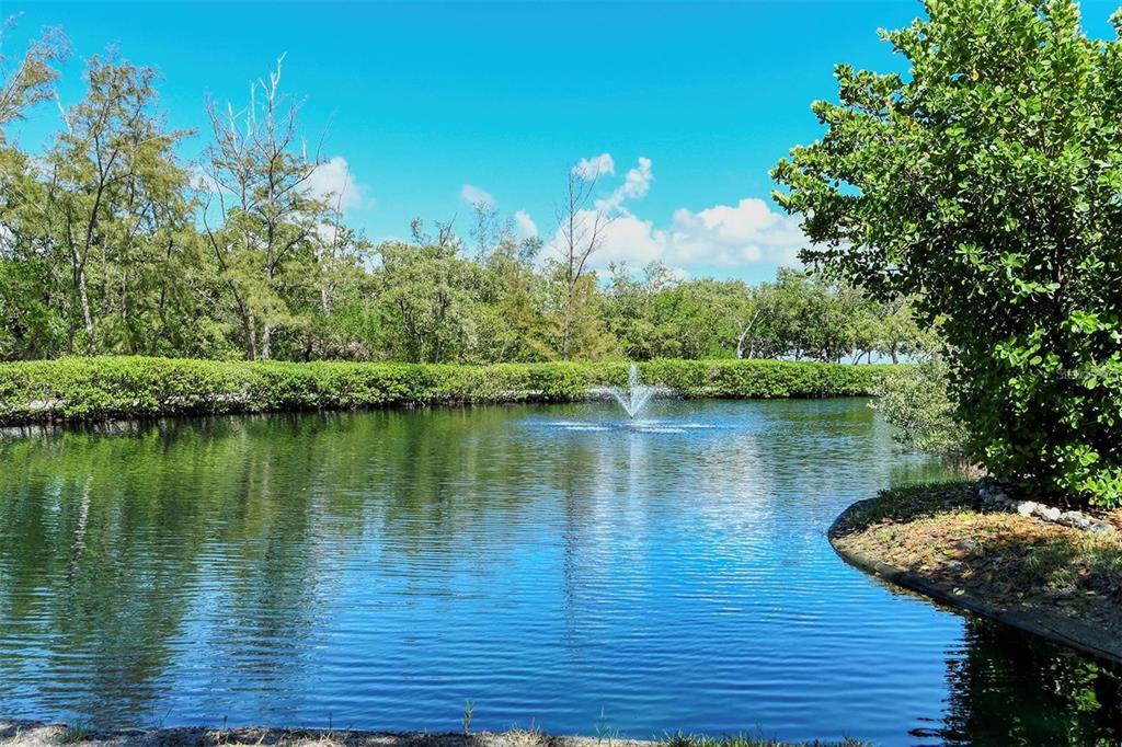 829 Bayport Way, Unit 829 Longboat Key, FL 34228 - Photo 45 of 58 a view of a lake with a outdoor space