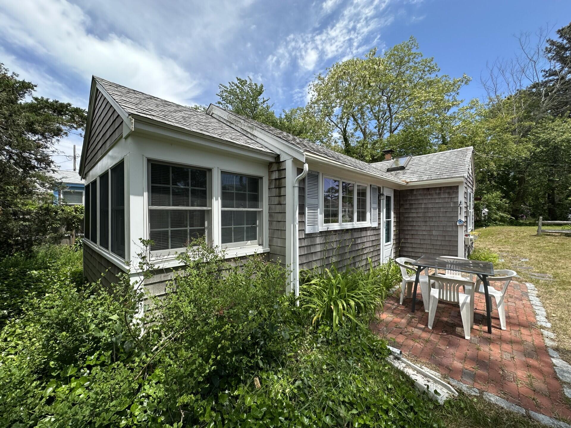 18 Myrtle Lane Dennis Port, MA 02639 - Photo 21 of 25 a view of house with backyard space and garden