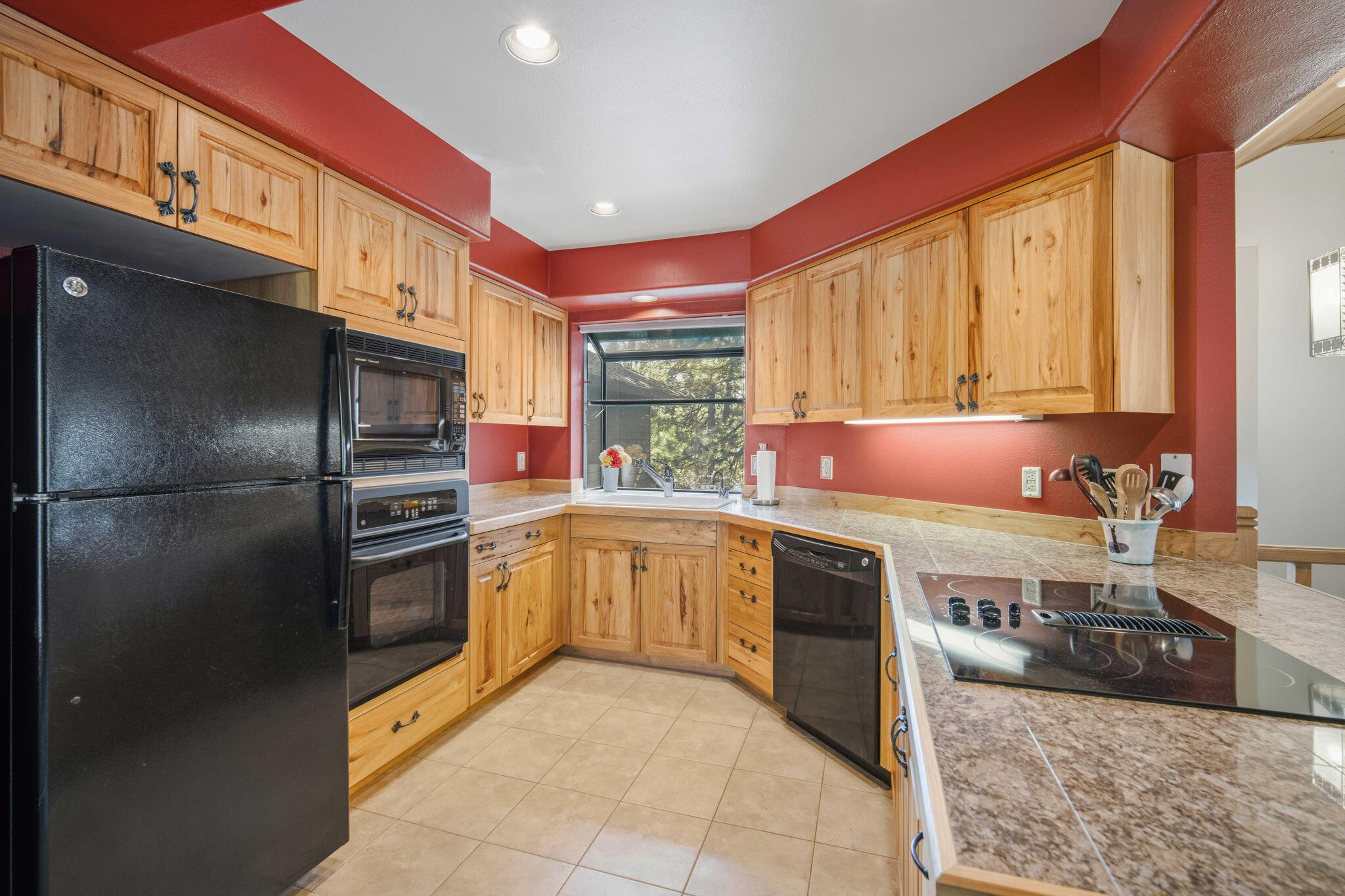 17682 Bittern Lane, Unit 31 Sunriver, OR 97707 - Photo 13 of 44 a kitchen with stainless steel appliances granite countertop a refrigerator sink and cabinets