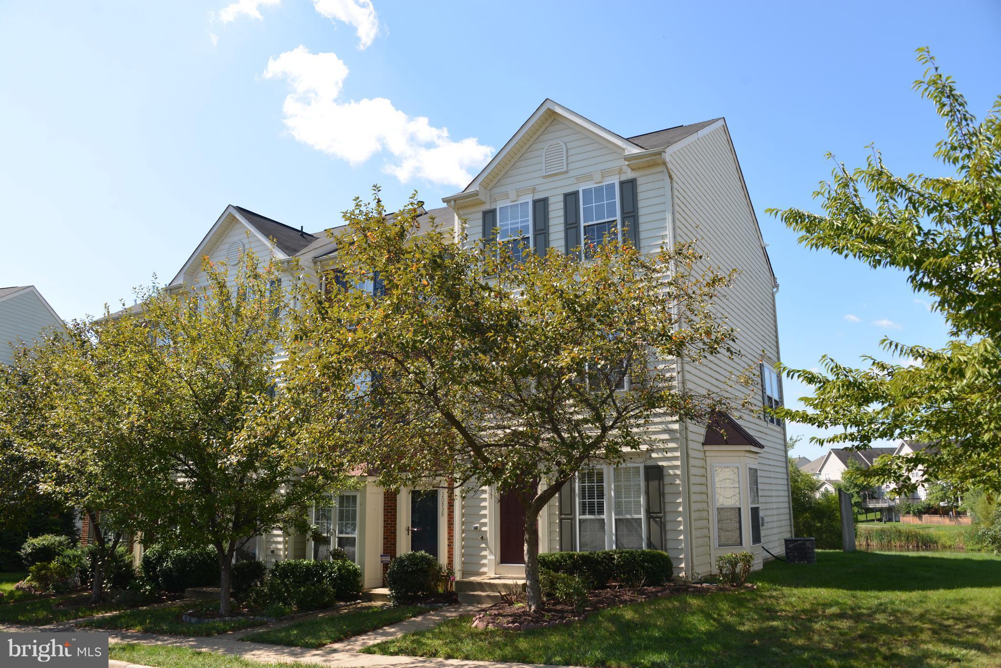 front view of a house with a garden