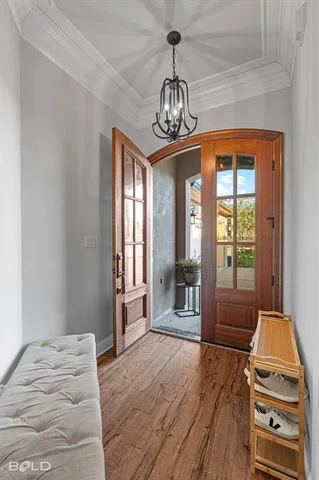 a view of a livingroom with wooden floor and a window