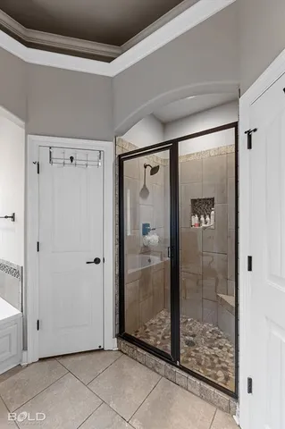 a view of a bathroom with a glass shower door