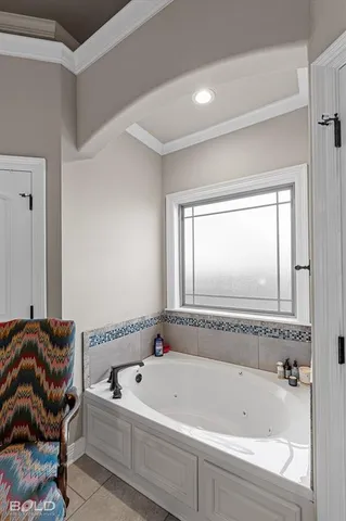 a bathroom with a bathtub and a window