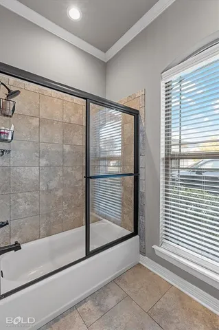 a bathroom with a glass shower door