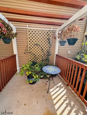 a view of a chairs and table in the patio