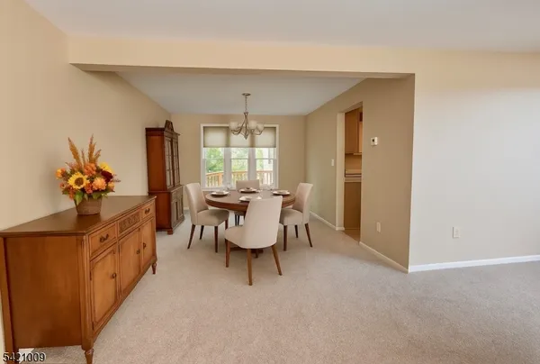 a view of a livingroom with furniture and window
