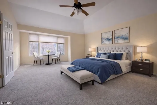 a spacious bedroom with a bed and window
