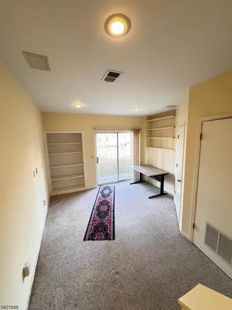 a view of room with furniture and a window