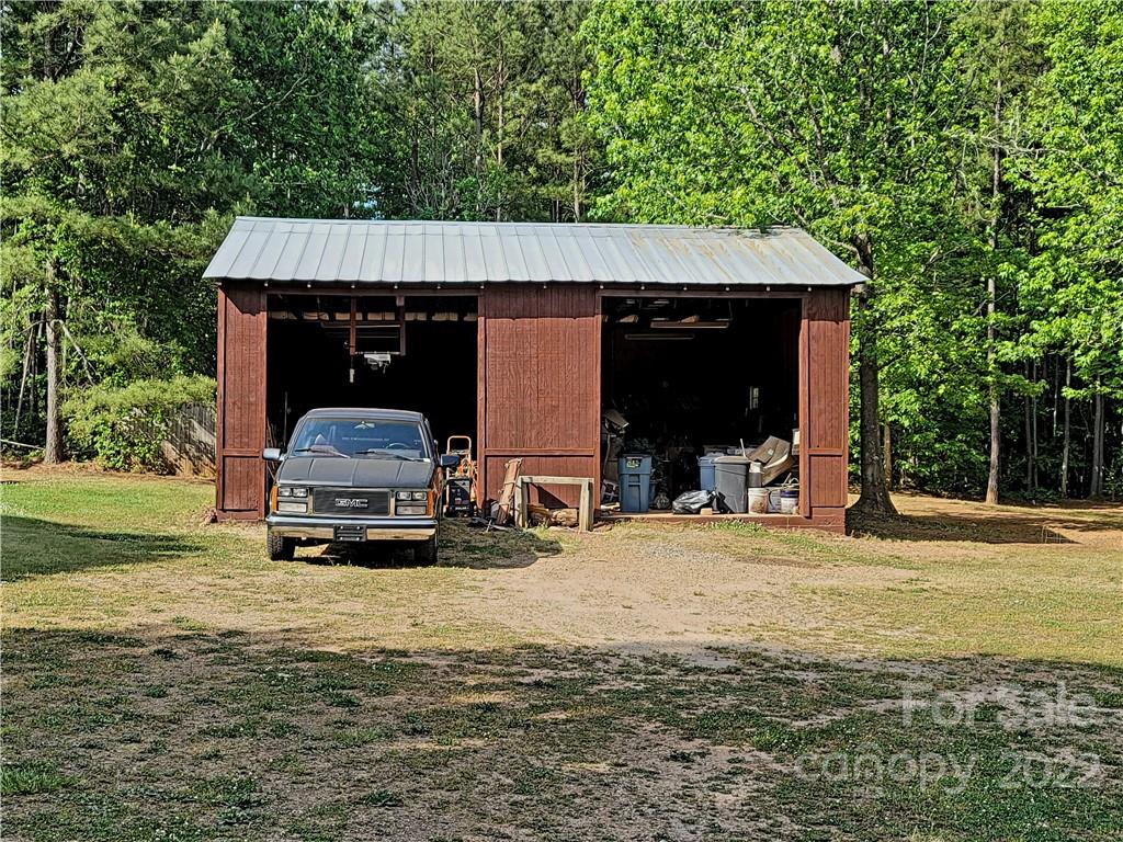 611 Mc Dowell Road Columbus, NC 28722 - Photo 27 of 39 a car parked in front of a house