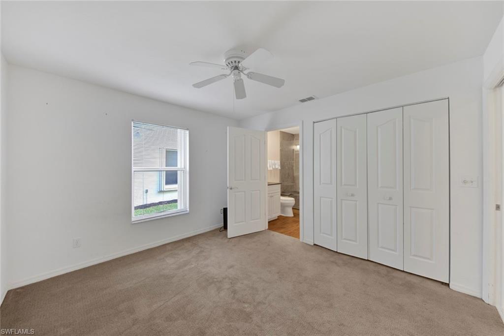 2912 West Crown Pointe Boulevard, Unit 141 Naples, FL 34112 - Photo 16 of 32 a view of an empty room with a window