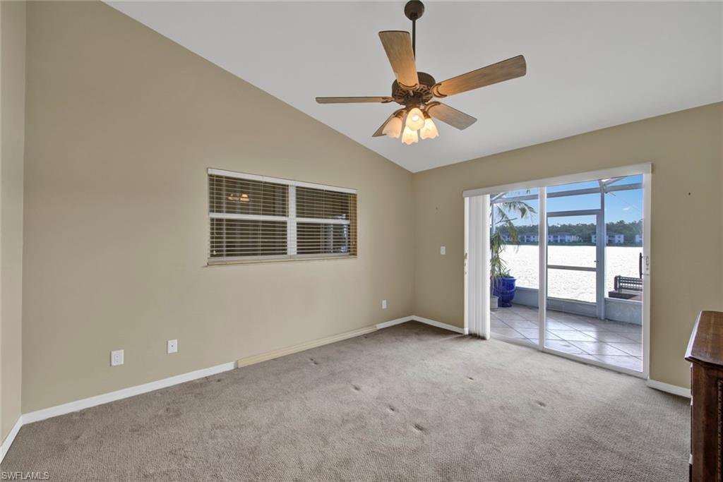 2912 West Crown Pointe Boulevard, Unit 141 Naples, FL 34112 - Photo 20 of 32 an empty room with windows and fan