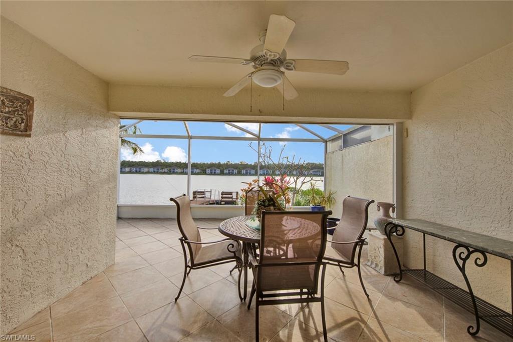 2912 West Crown Pointe Boulevard, Unit 141 Naples, FL 34112 - Photo 25 of 32 a dining room with furniture and window