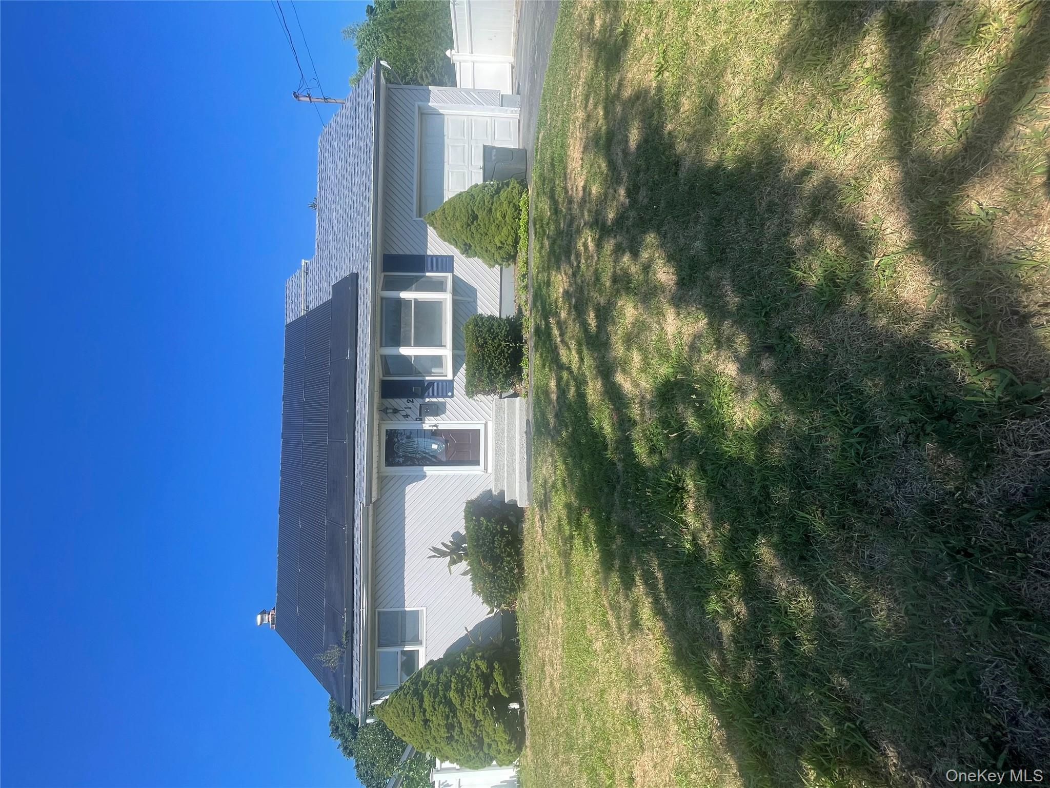 a view of a house with a big yard