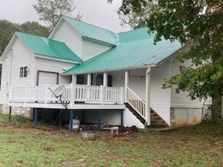 234 Alsup Road Prospect, TN 38477 - Photo 27 of 38 a view of a house with a yard and deck