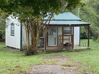 234 Alsup Road Prospect, TN 38477 - Photo 31 of 38 a front view of a house with garden