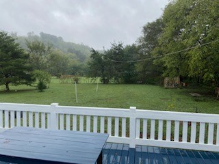 234 Alsup Road Prospect, TN 38477 - Photo 33 of 38 a view of a wooden deck and yard with green space
