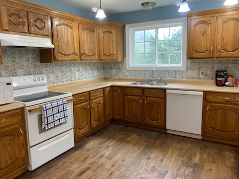 234 Alsup Road Prospect, TN 38477 - Photo 10 of 38 a kitchen with stainless steel appliances granite countertop a sink a stove cabinets and wooden floor