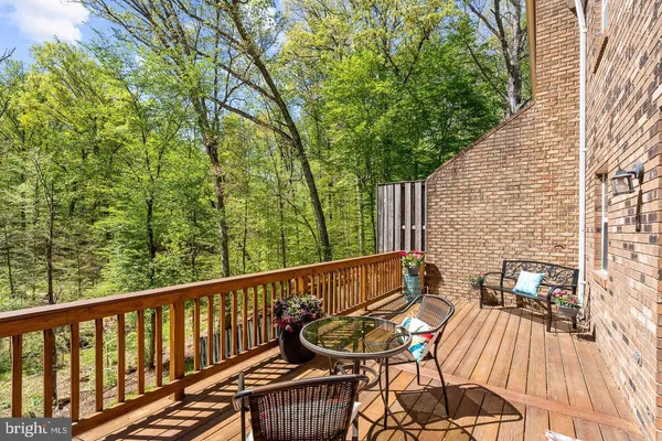 a view of a patio with a table and chairs