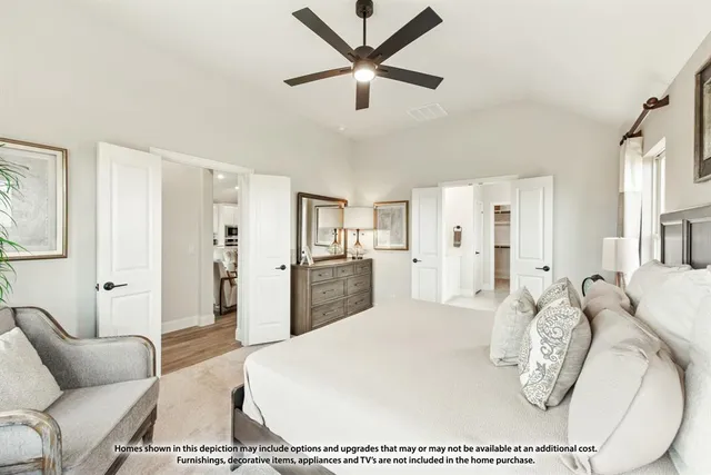 a living room with furniture a ceiling fan and a rug