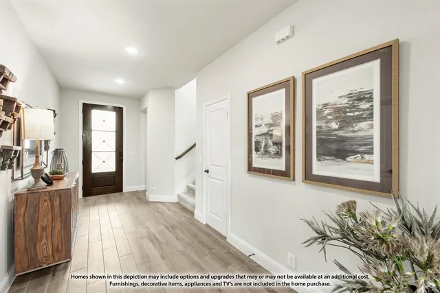 a view of a living room and a wooden floor