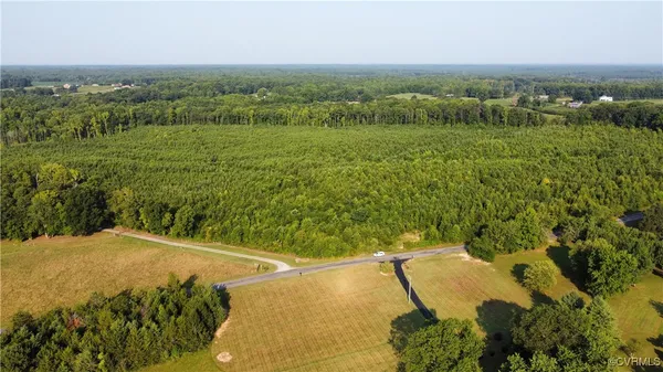 a view of a field with an ocean view