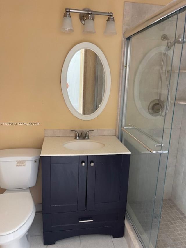 1325 North 16th Court, Unit 2 Hollywood, FL 33020 - Photo 3 of 5 a bathroom with a sink and a mirror