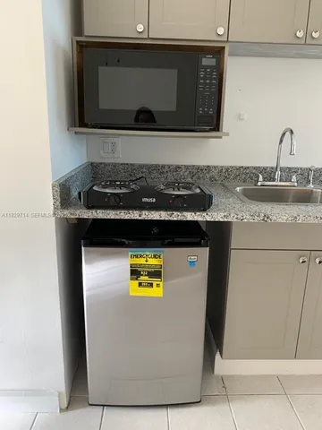 a kitchen with a stove and a microwave