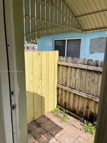 a view of a house with a wooden door