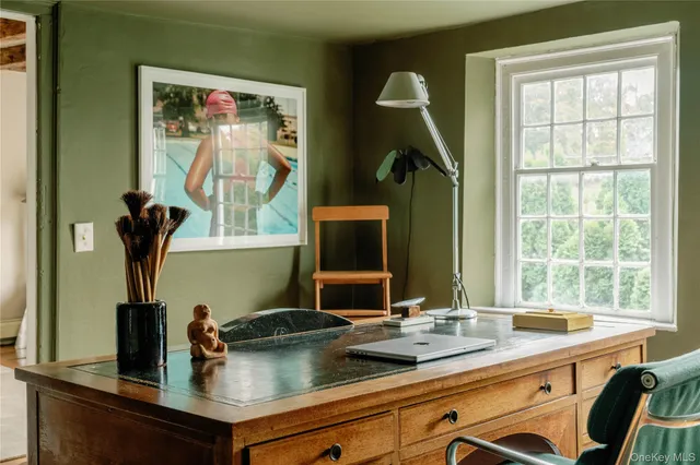 a bedroom with a bed and a lamp