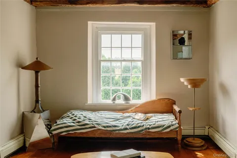 a bedroom with a bed a desk and chair