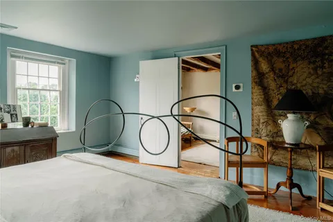 a bathroom with a sink a mirror and a shower