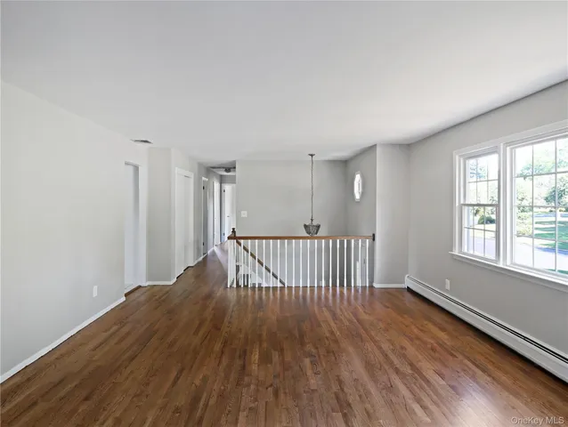 a view of entryway with wooden floor