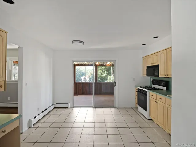 a kitchen with a sink a stove and cabinets