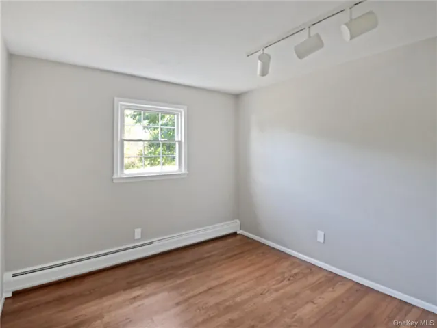 a view of livingroom with furniture and floor to ceiling window