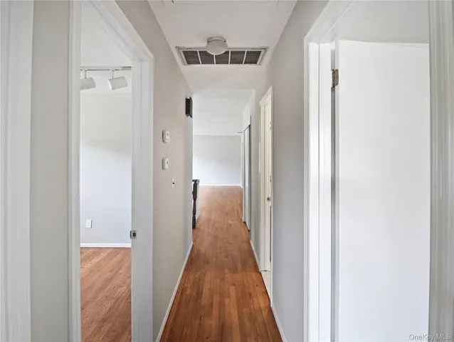 a view of entryway with wooden floor