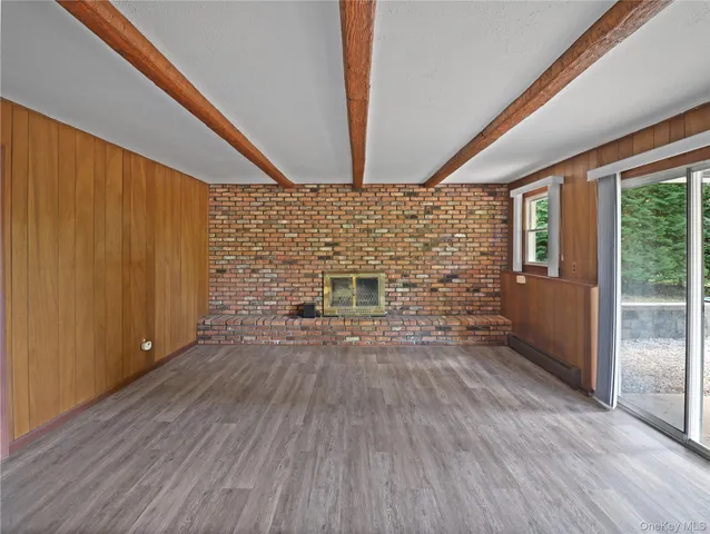 a view of a livingroom with wooden floor