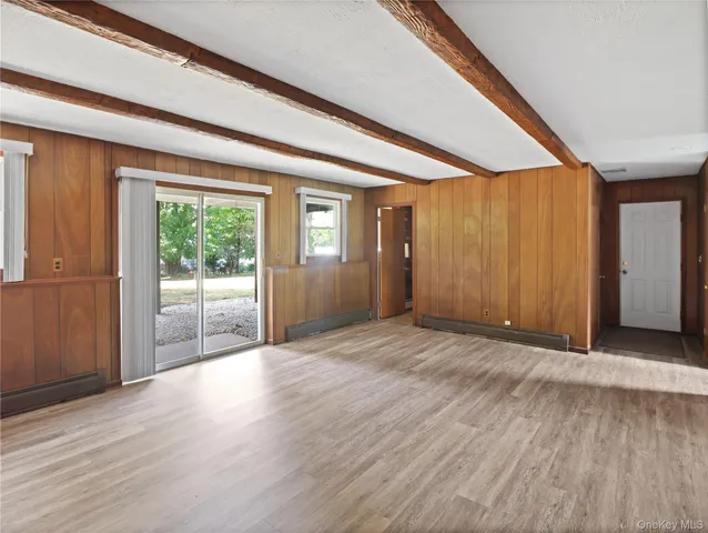a view of a room with wooden floor and stairs