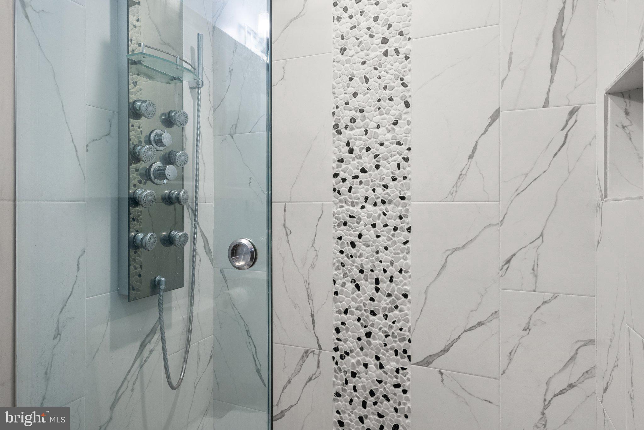 1275 Oates Street Northeast Washington, DC 20002 - Photo 21 of 40 a bathroom with a shower and a glass door